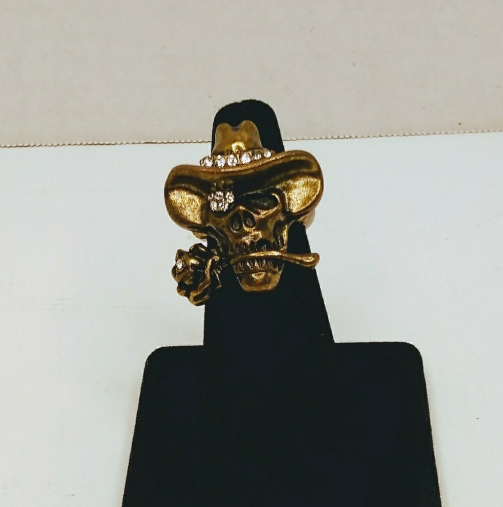 Stretch to fit ring. Bronze colored.